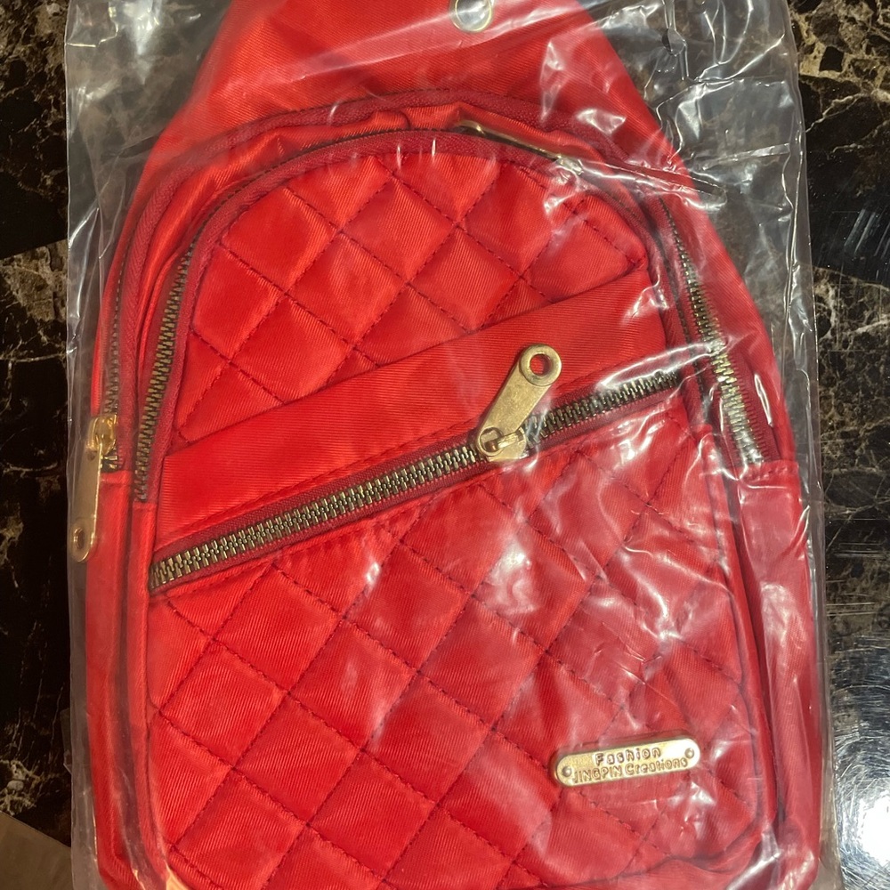 Red Quilted Backpack with Gold Accents
